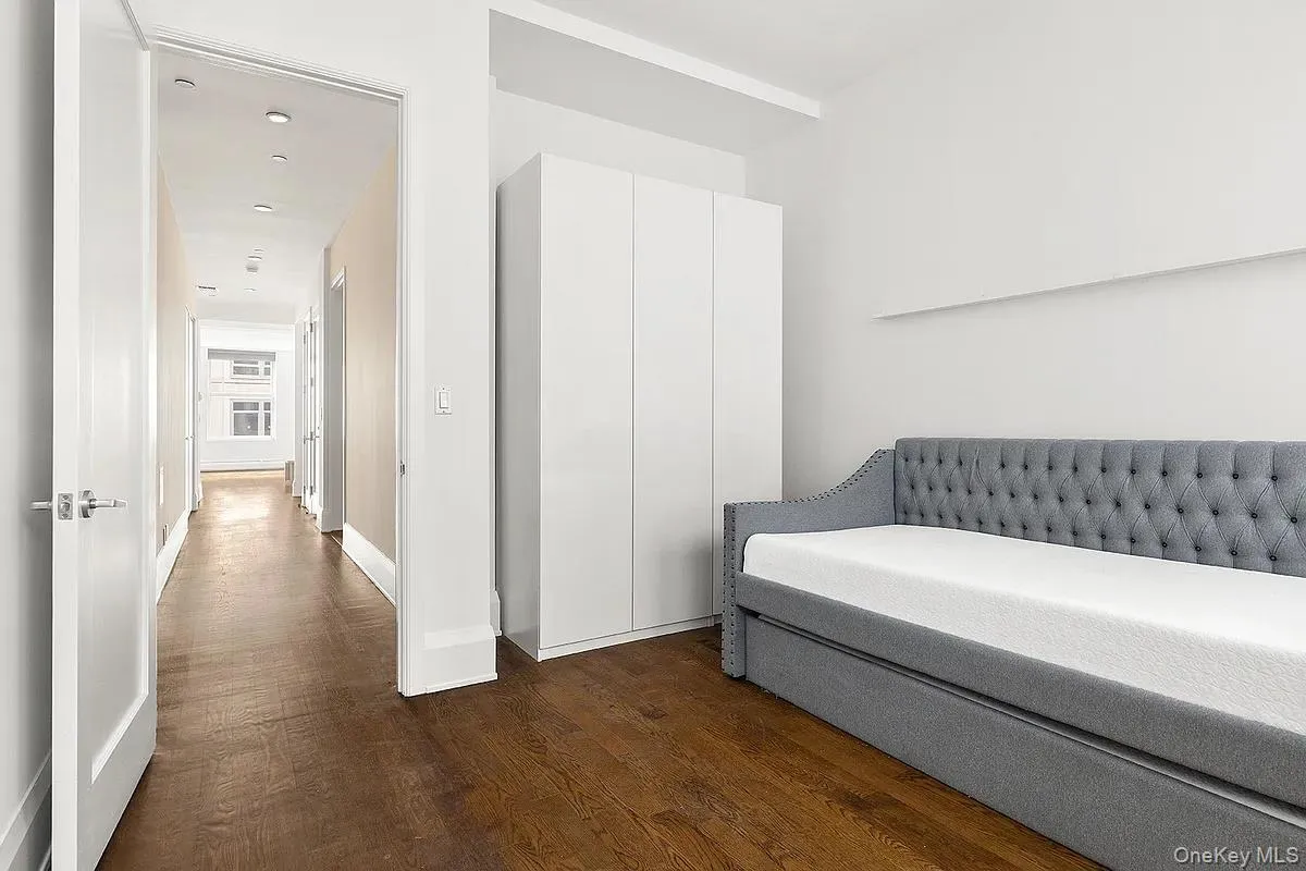 Bedroom featuring dark wood finished floors and recessed lighting Bedroom featuring dark wood finished floors and recessed lighting