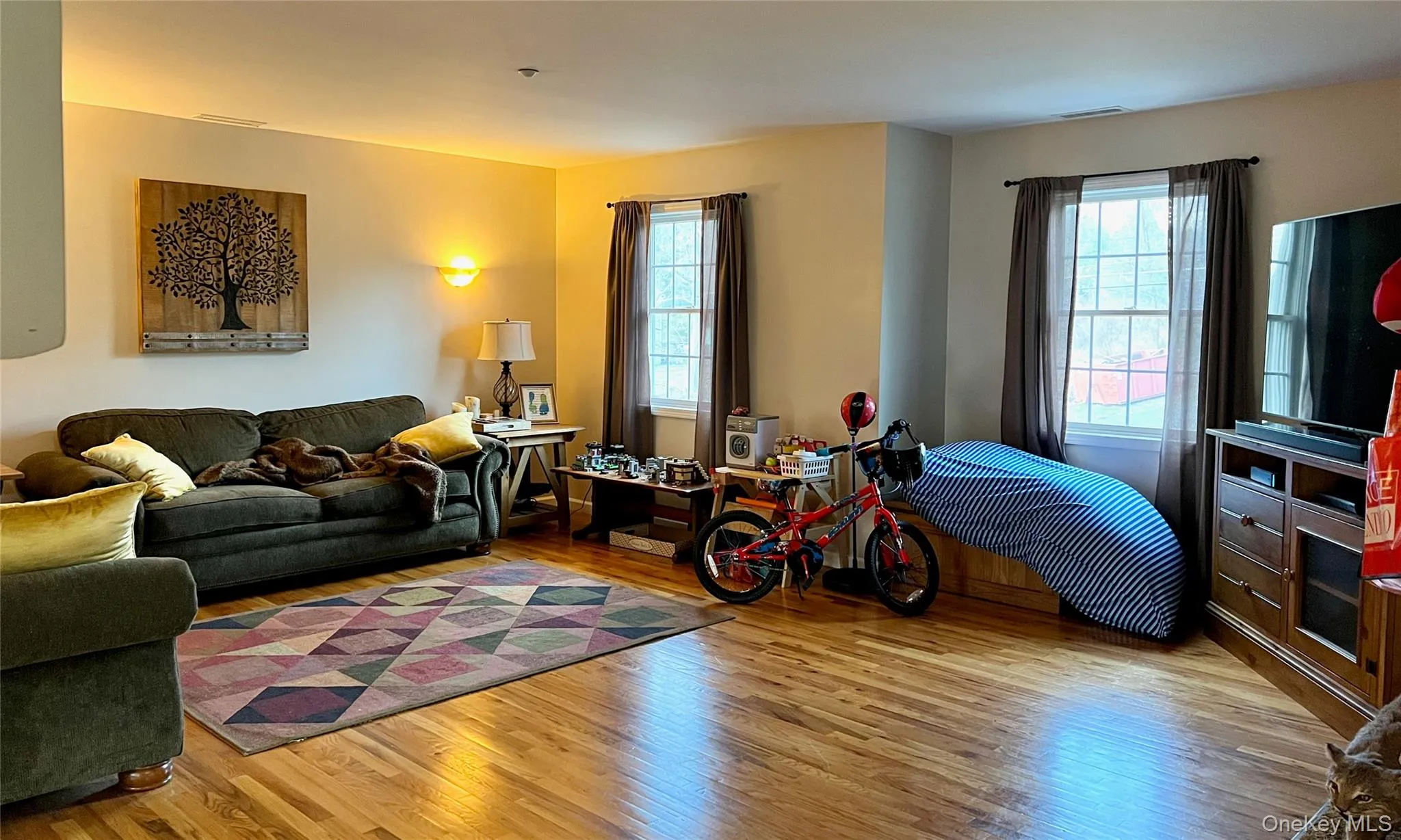 Living room featuring light wood-style flooring Living room featuring light wood-style flooring