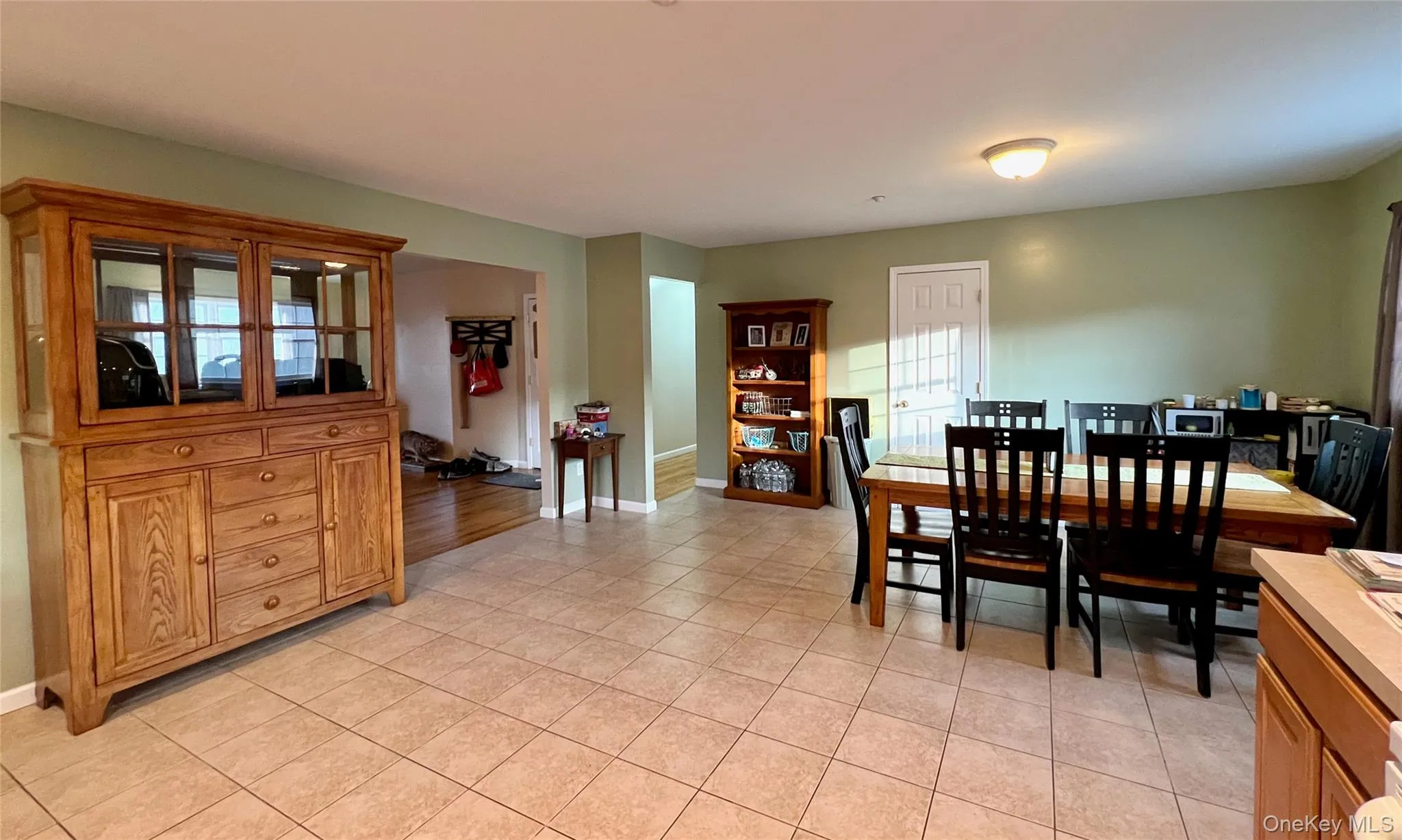 Dining room with light tile patterned floors and healthy amount of natural light Dining room with light tile patterned floors and healthy amount of natural light