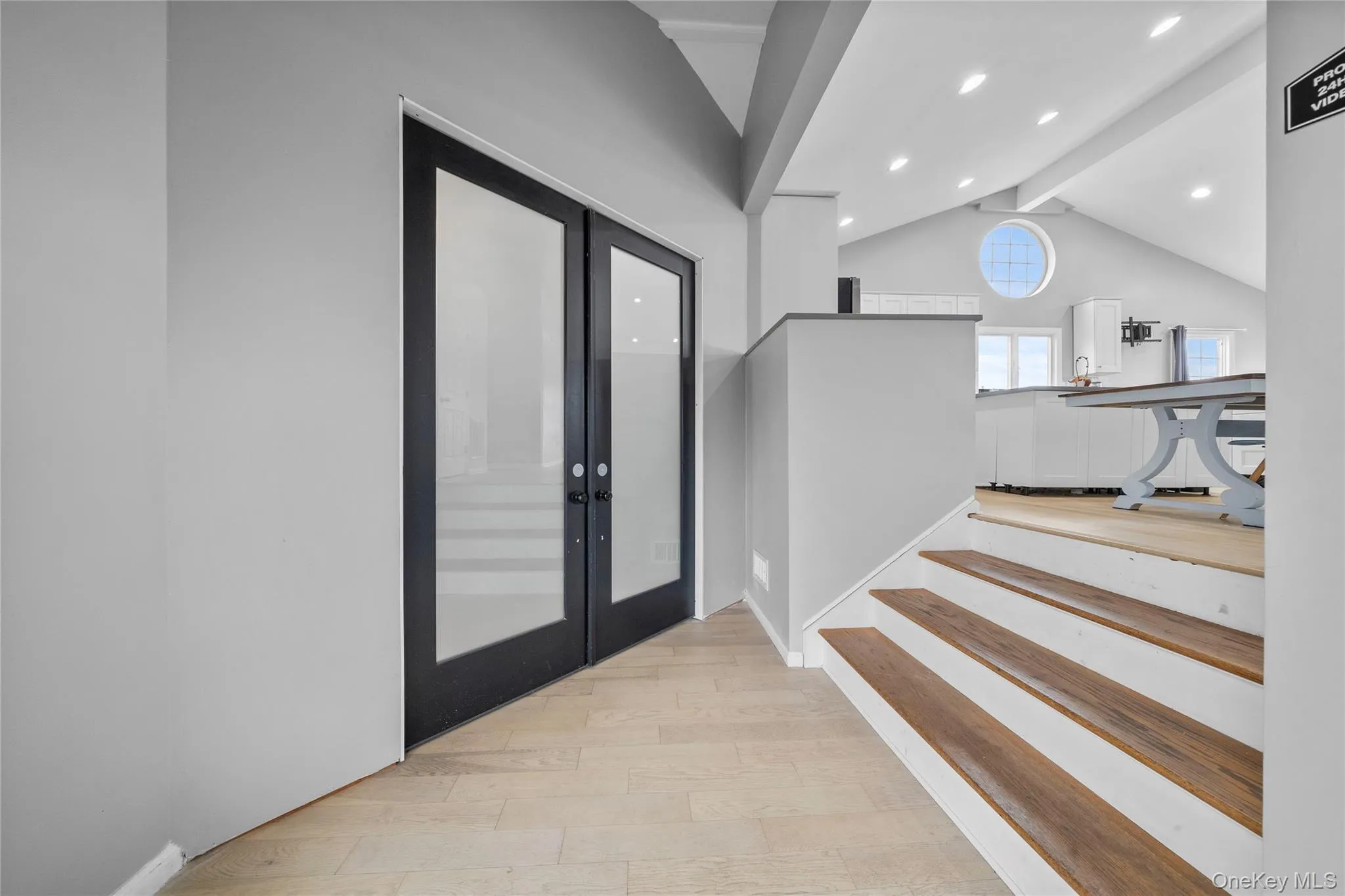 Entryway featuring light wood-style floors, recessed lighting, and french doors Entryway featuring light wood-style floors, recessed lighting, and french doors