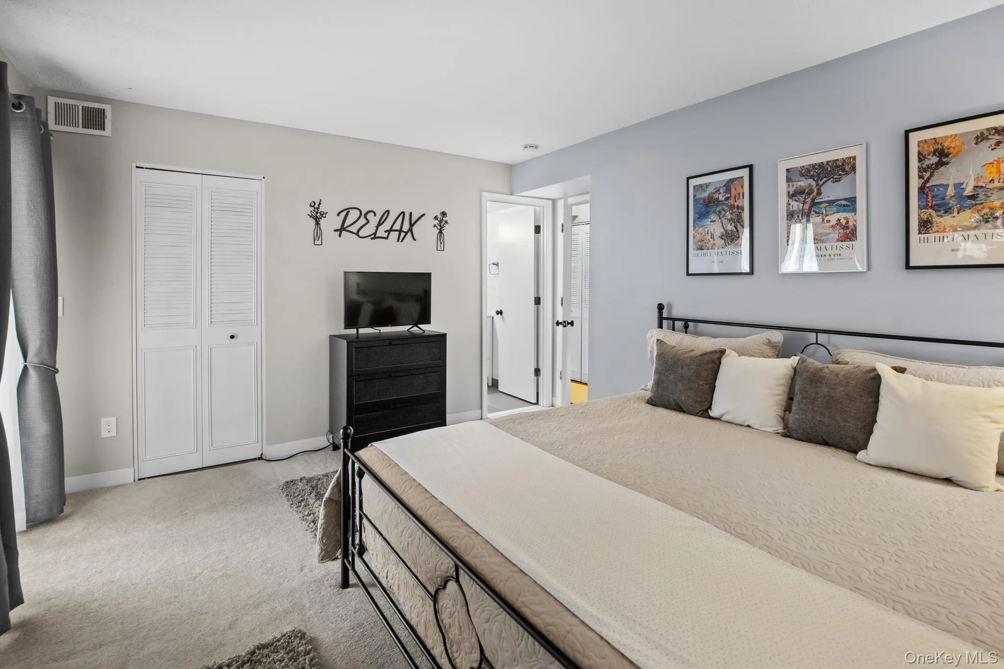 A serene primary bedroom includes generous closet space, soft carpet underfoot, and direct entry to the brand-new en-suite bathroom. A serene primary bedroom includes generous closet space, soft carpet underfoot, and direct entry to the brand-new en-suite bathroom.