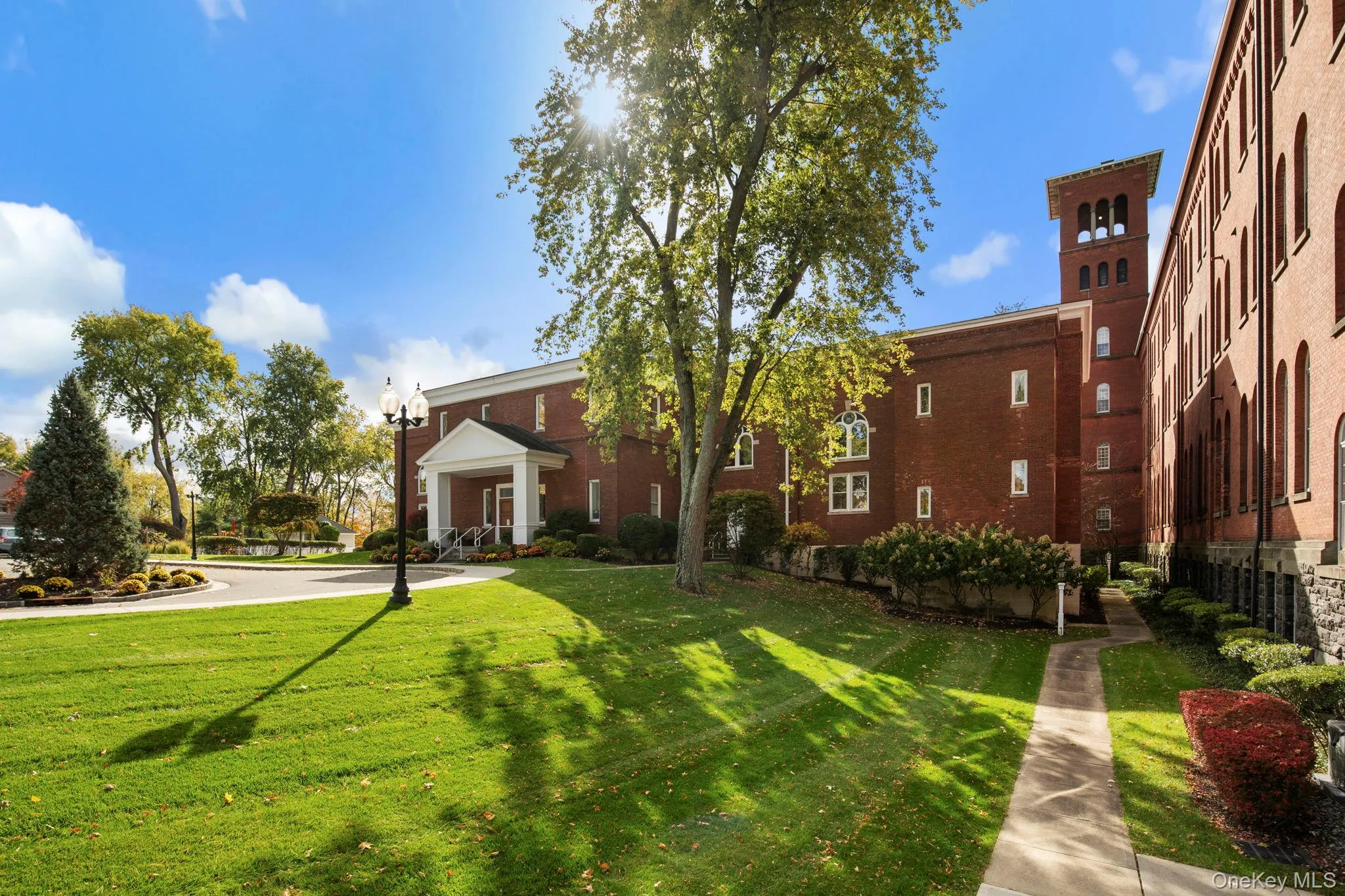 Beautifully maintained grounds and mature trees frame the back of the clubhouse, offering a serene setting for residents to enjoy. Beautifully maintained grounds and mature trees frame the back of the clubhouse, offering a serene setting for residents to enjoy.