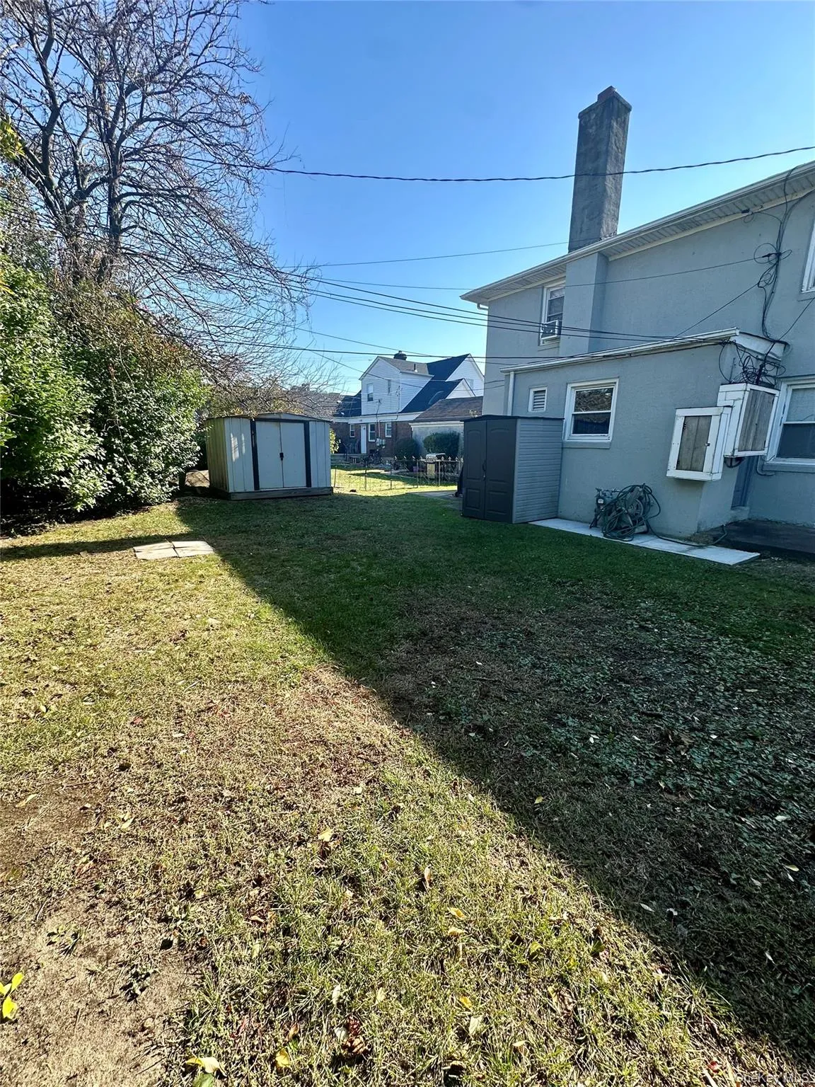 View of green lawn featuring a shed View of green lawn featuring a shed