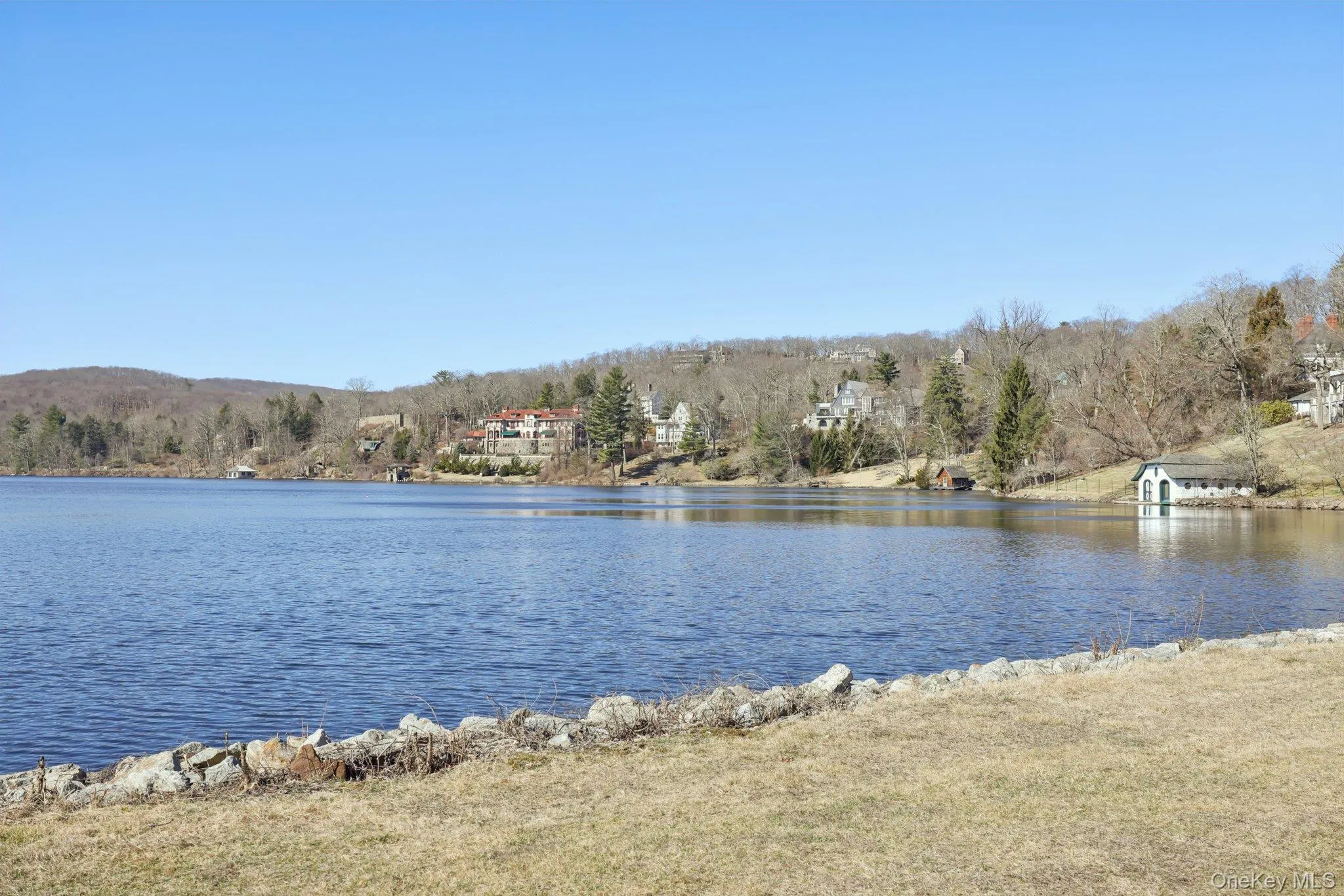Water view with a heavily wooded area Water view with a heavily wooded area