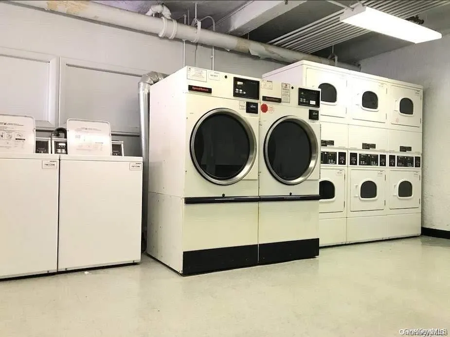 Shared laundry room featuring washer and dryer Shared laundry room featuring washer and dryer