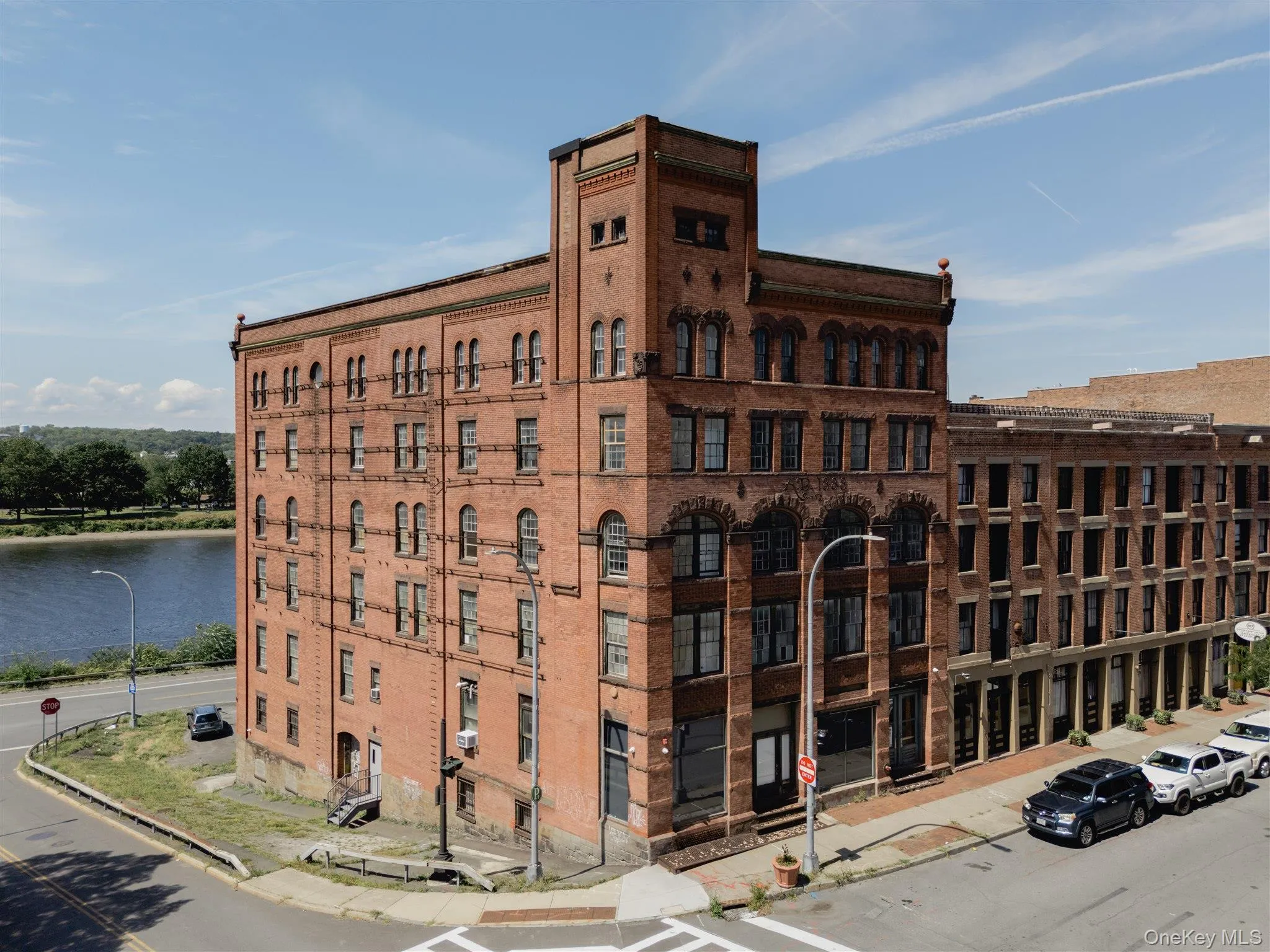 View of apartment building / complex with a water view View of apartment building / complex with a water view