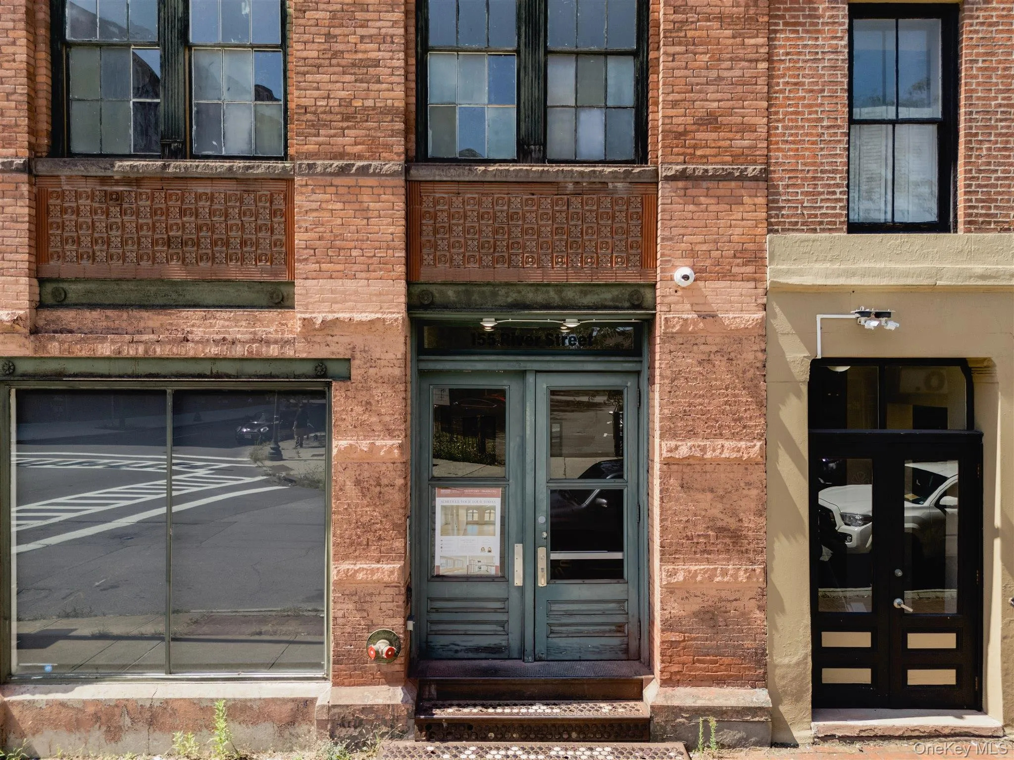 Entrance to property with brick siding and french doors Entrance to property with brick siding and french doors
