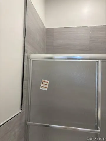 Full bathroom with a shower stall Full bathroom with a shower stall