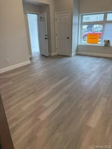 Empty room featuring wood finished floors Empty room featuring wood finished floors