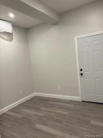 Finished basement featuring dark wood-style floors and recessed lighting Finished basement featuring dark wood-style floors and recessed lighting
