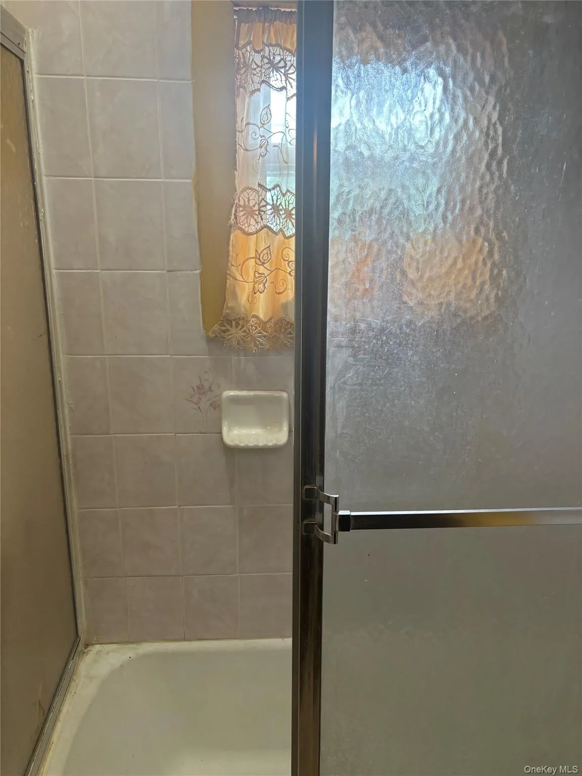 Full bathroom with a stall shower Full bathroom with a stall shower
