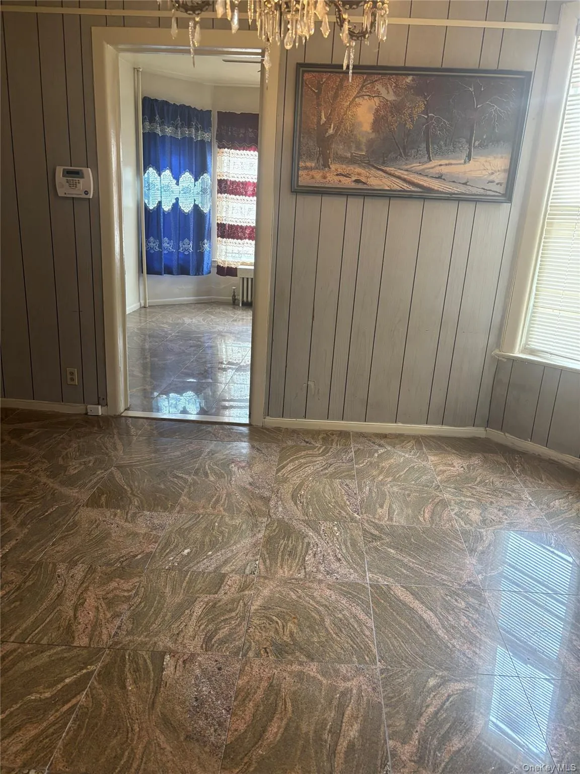 Dining area with a chandelier Dining area with a chandelier