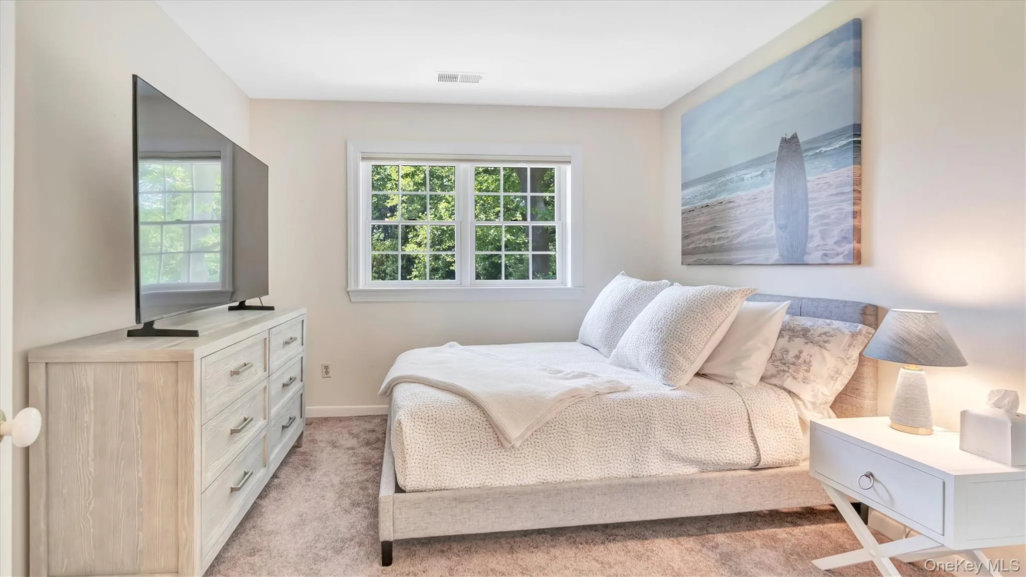 2 nd Bedroom featuring light carpet and baseboards 2 nd Bedroom featuring light carpet and baseboards