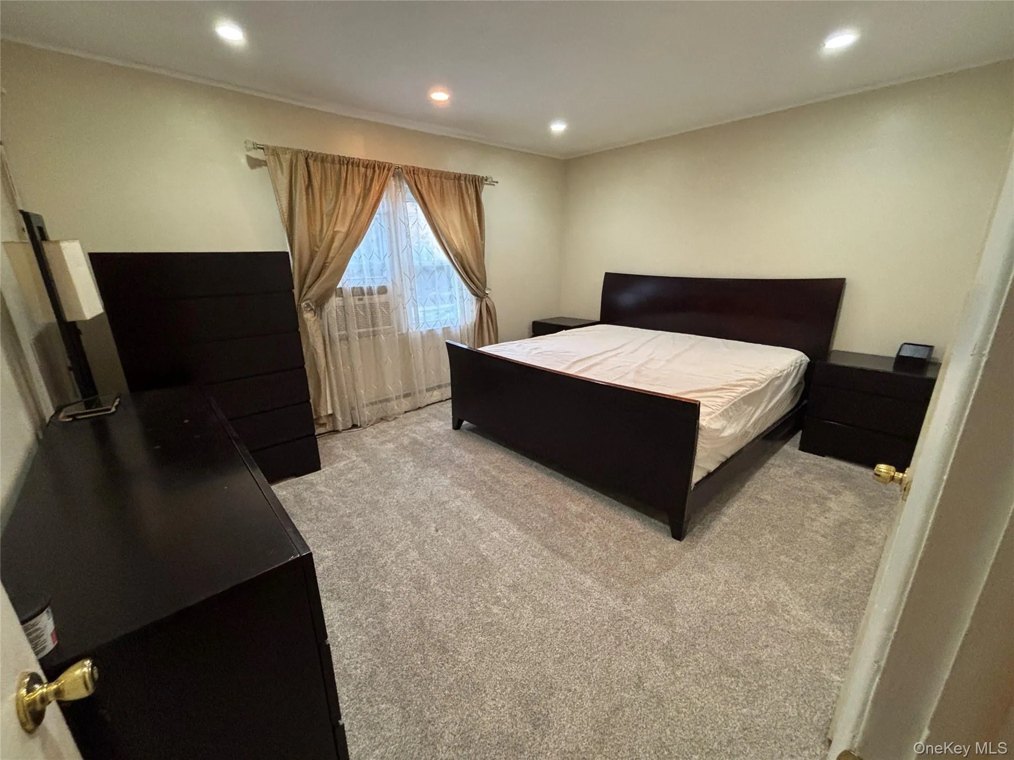 Bedroom with carpet flooring and recessed lighting Bedroom with carpet flooring and recessed lighting