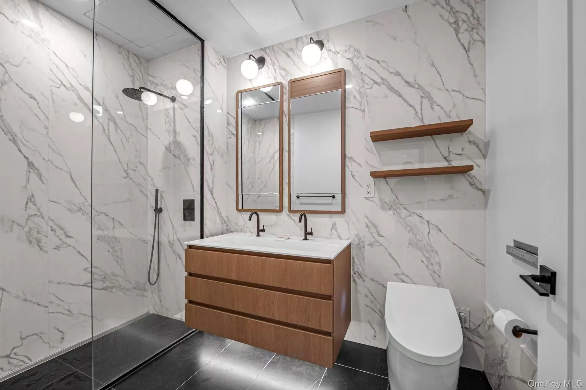 Full bathroom with stone wall, tile walls, a marble finish shower, and vanity Full bathroom with stone wall, tile walls, a marble finish shower, and vanity