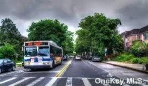 View of asphalt street featuring sidewalks and curbs View of asphalt street featuring sidewalks and curbs