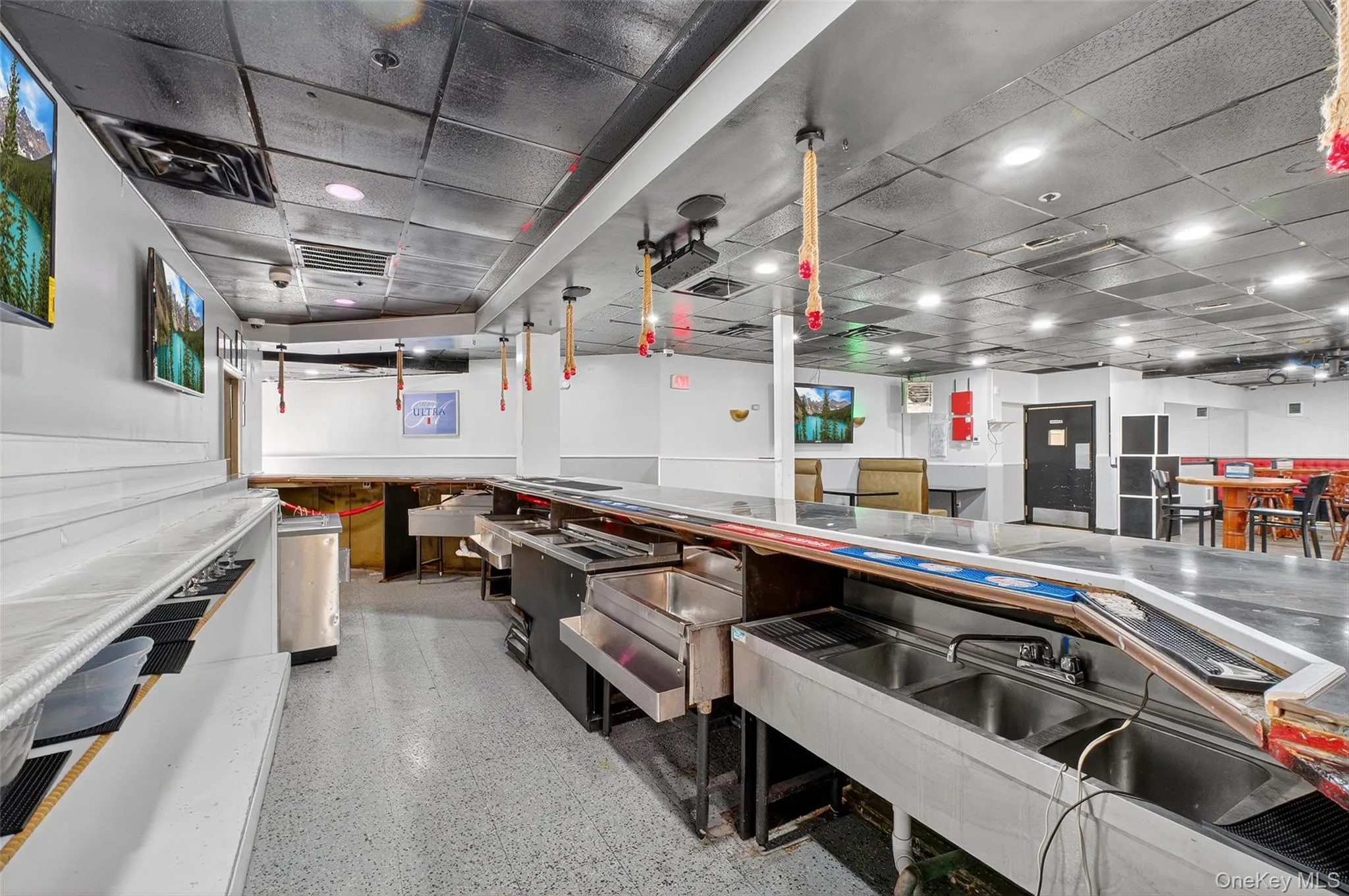 Kitchen with a wainscoted wall and a paneled ceiling Kitchen with a wainscoted wall and a paneled ceiling