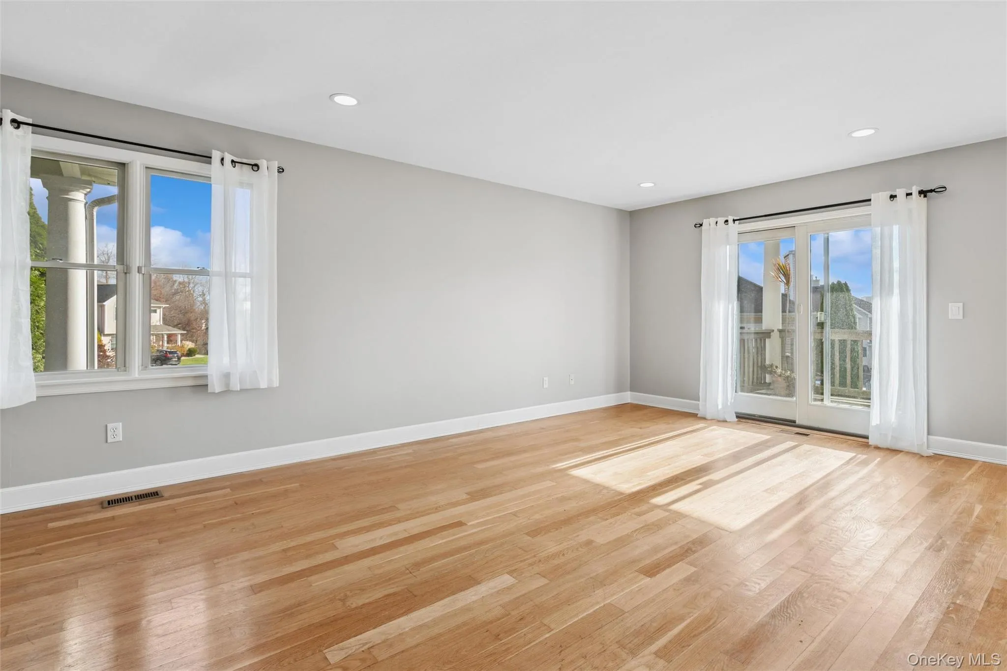 Empty room featuring light wood-style flooring and recessed lighting Empty room featuring light wood-style flooring and recessed lighting
