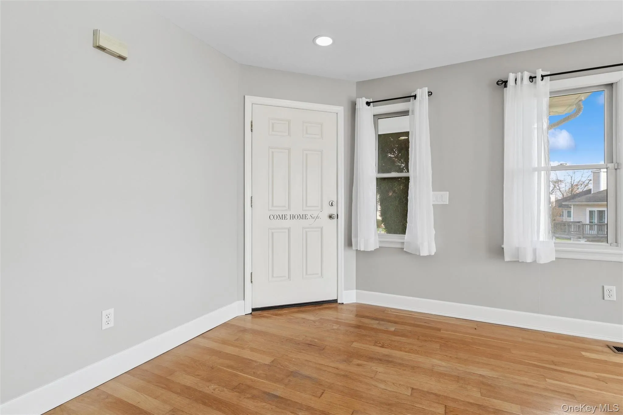 Empty room featuring light wood-style flooring and recessed lighting Empty room featuring light wood-style flooring and recessed lighting