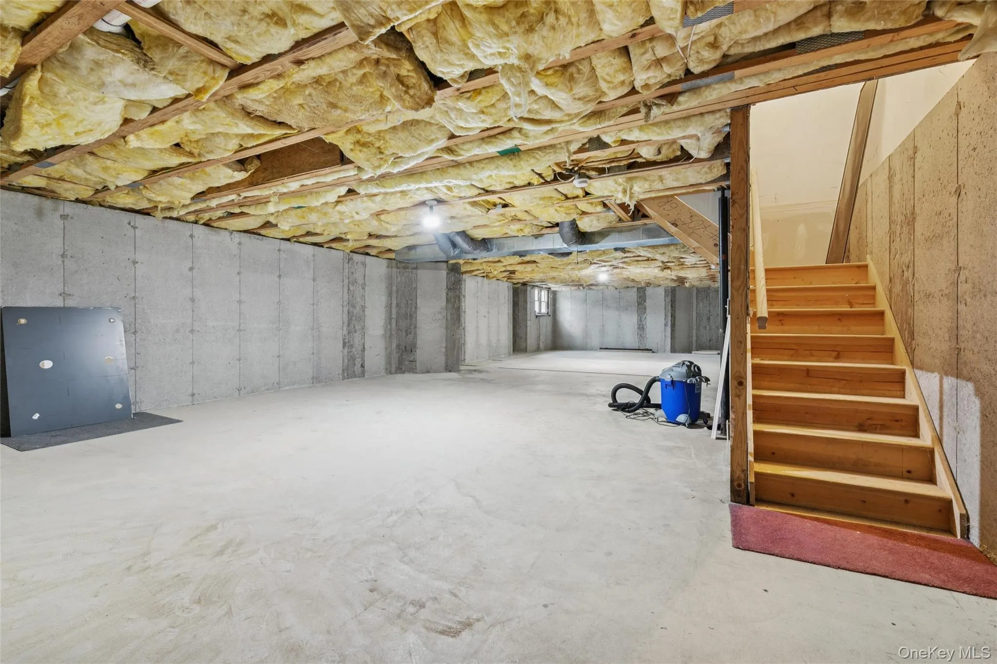 Unfinished basement with stairway Unfinished basement with stairway