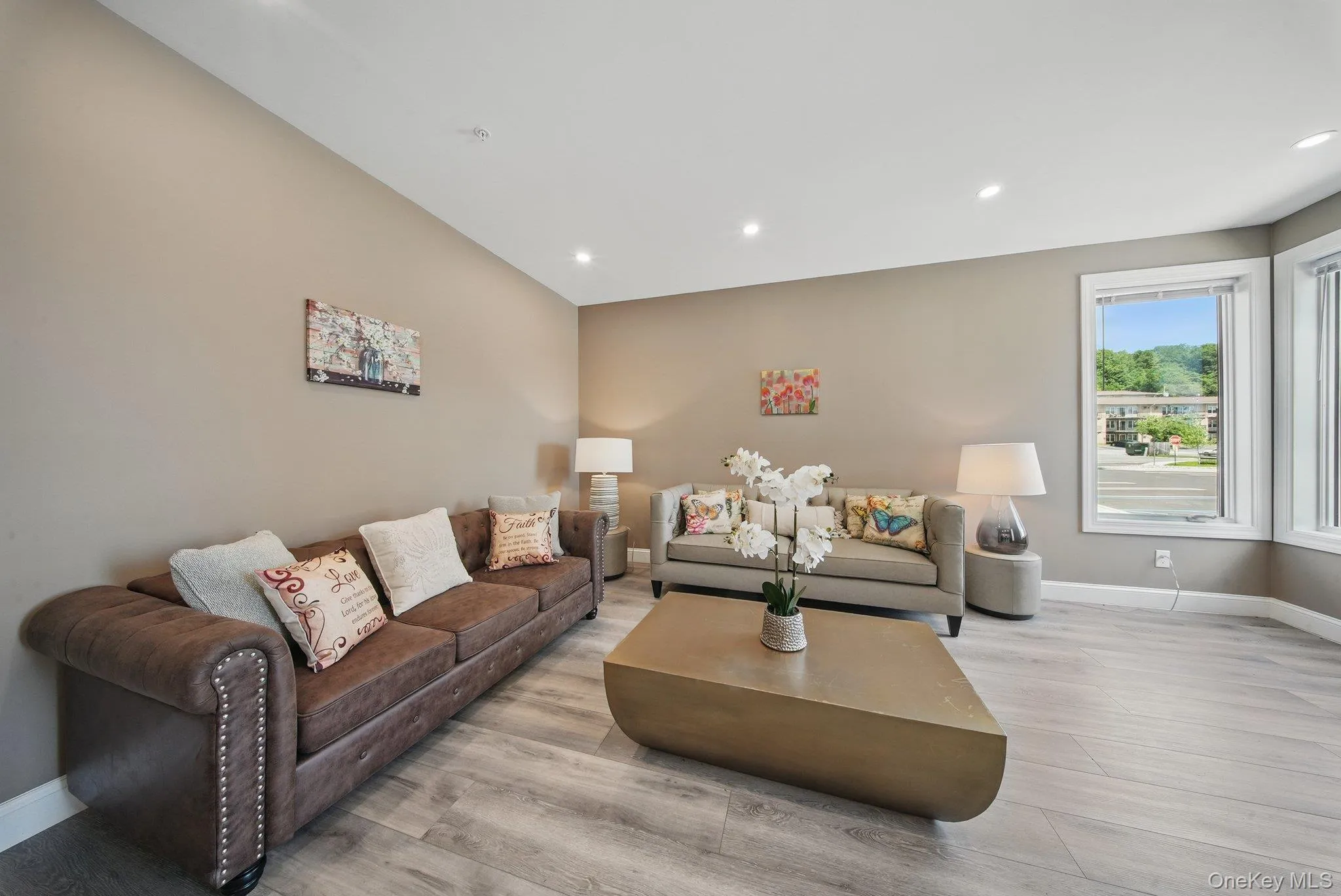 Living area featuring recessed lighting and light wood-type flooring Living area featuring recessed lighting and light wood-type flooring
