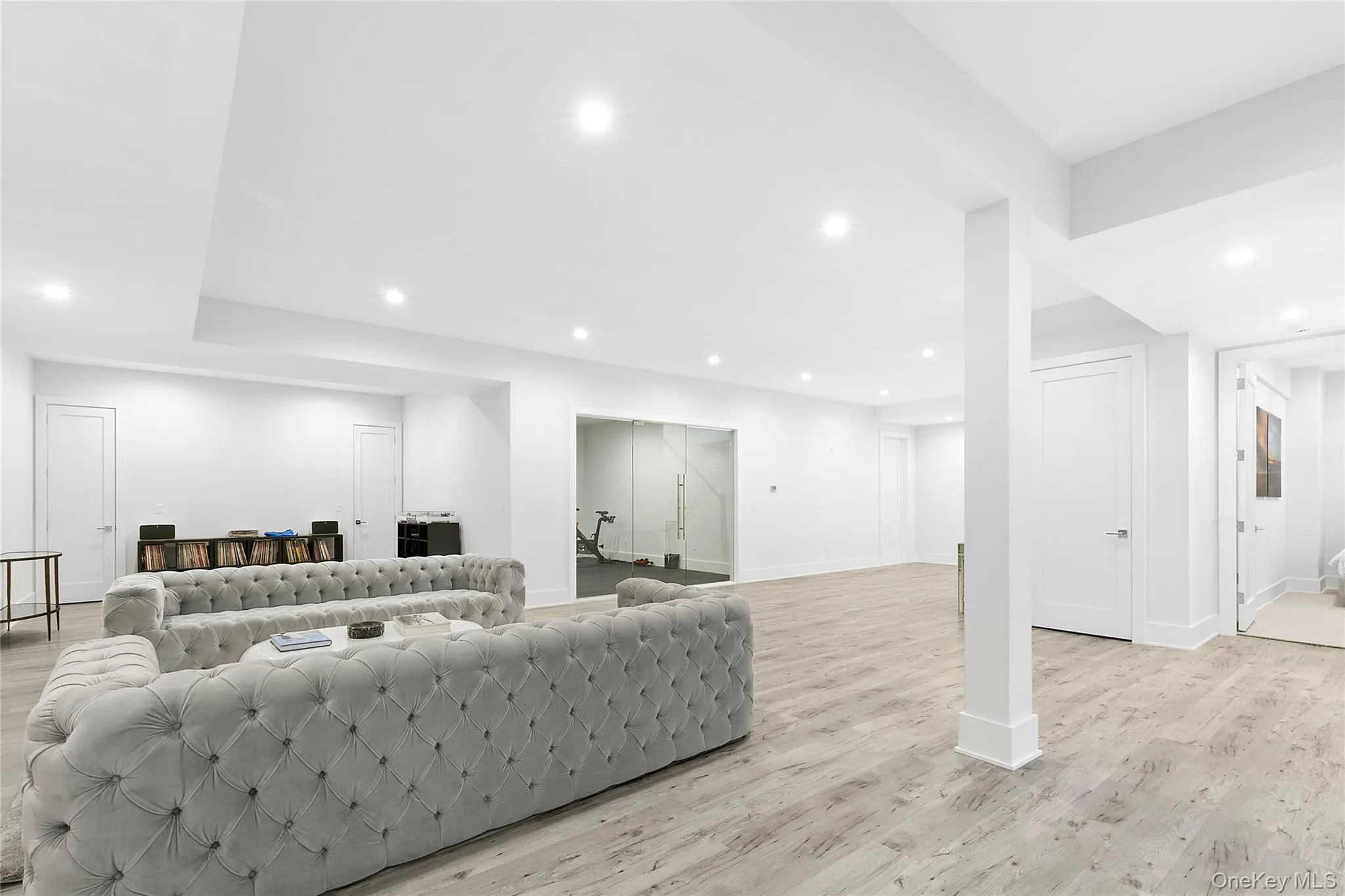 Living area featuring light wood-style floors and recessed lighting Living area featuring light wood-style floors and recessed lighting