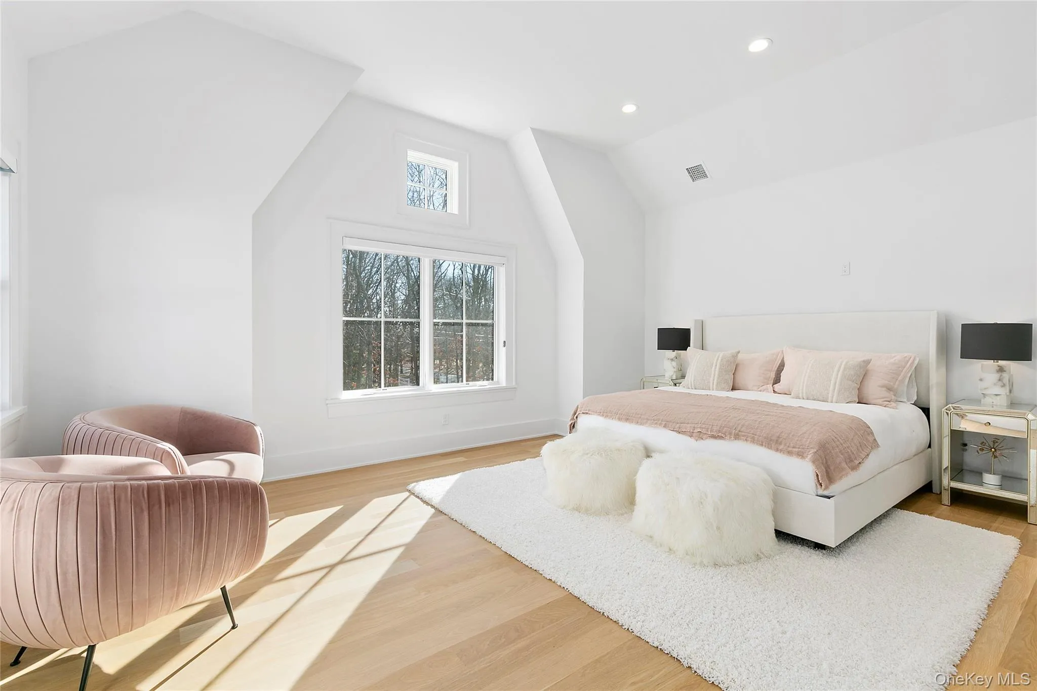 Bedroom featuring vaulted ceiling, light wood finished floors, and recessed lighting Bedroom featuring vaulted ceiling, light wood finished floors, and recessed lighting