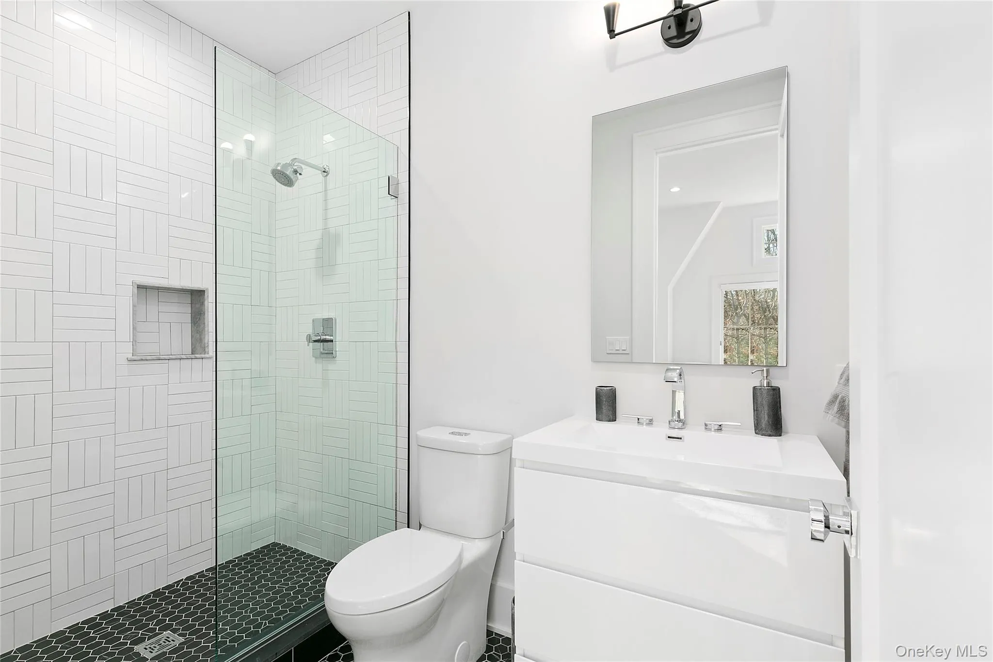 Full bath featuring a stall shower, vanity, and recessed lighting Full bath featuring a stall shower, vanity, and recessed lighting
