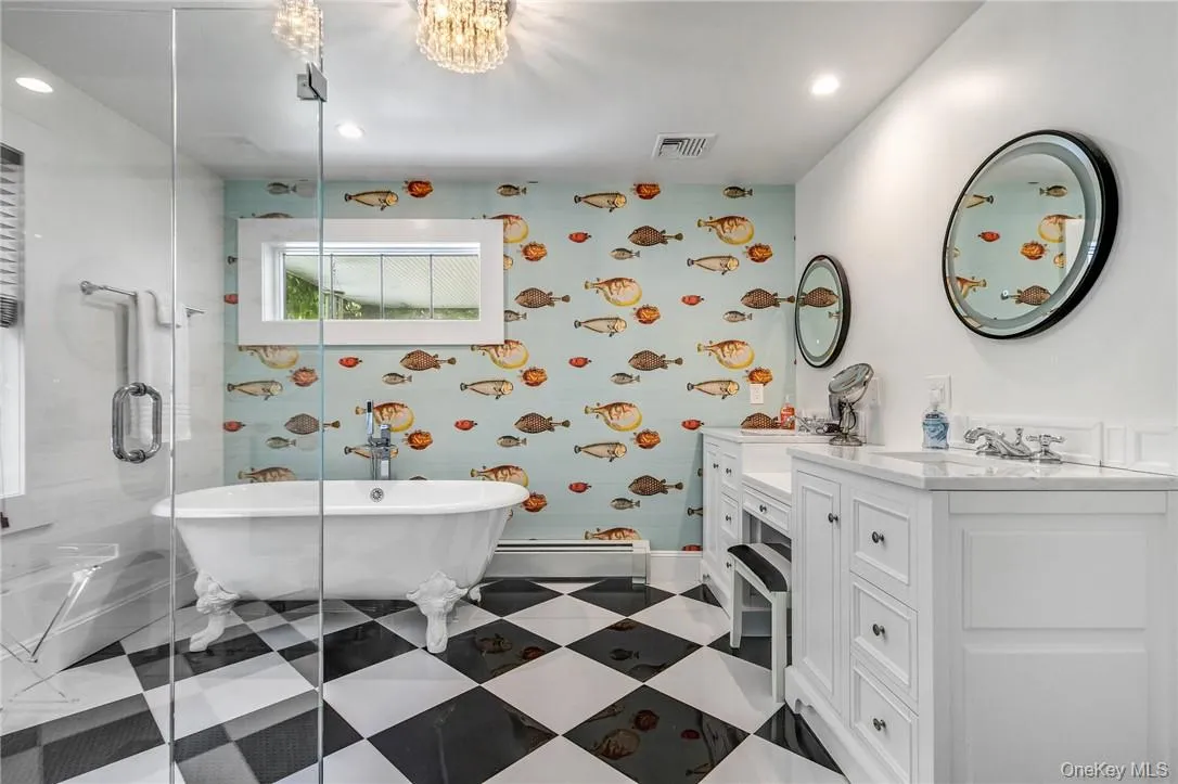 Bathroom featuring vanity, independent shower and bath Bathroom featuring vanity, independent shower and bath