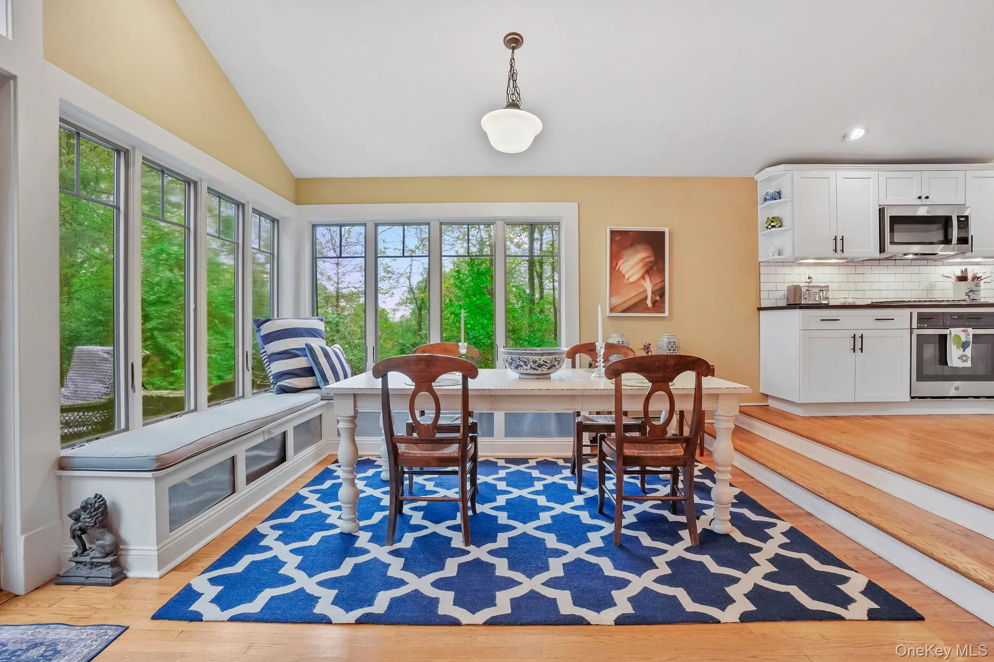 Dining area with recessed lighting, wall of windows. Dining area with recessed lighting, wall of windows.