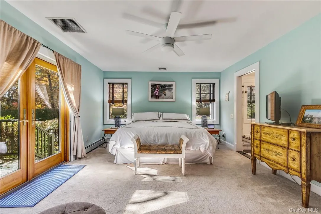 Bedroom featuring access to outside, and primary bathroom Bedroom featuring access to outside, and primary bathroom