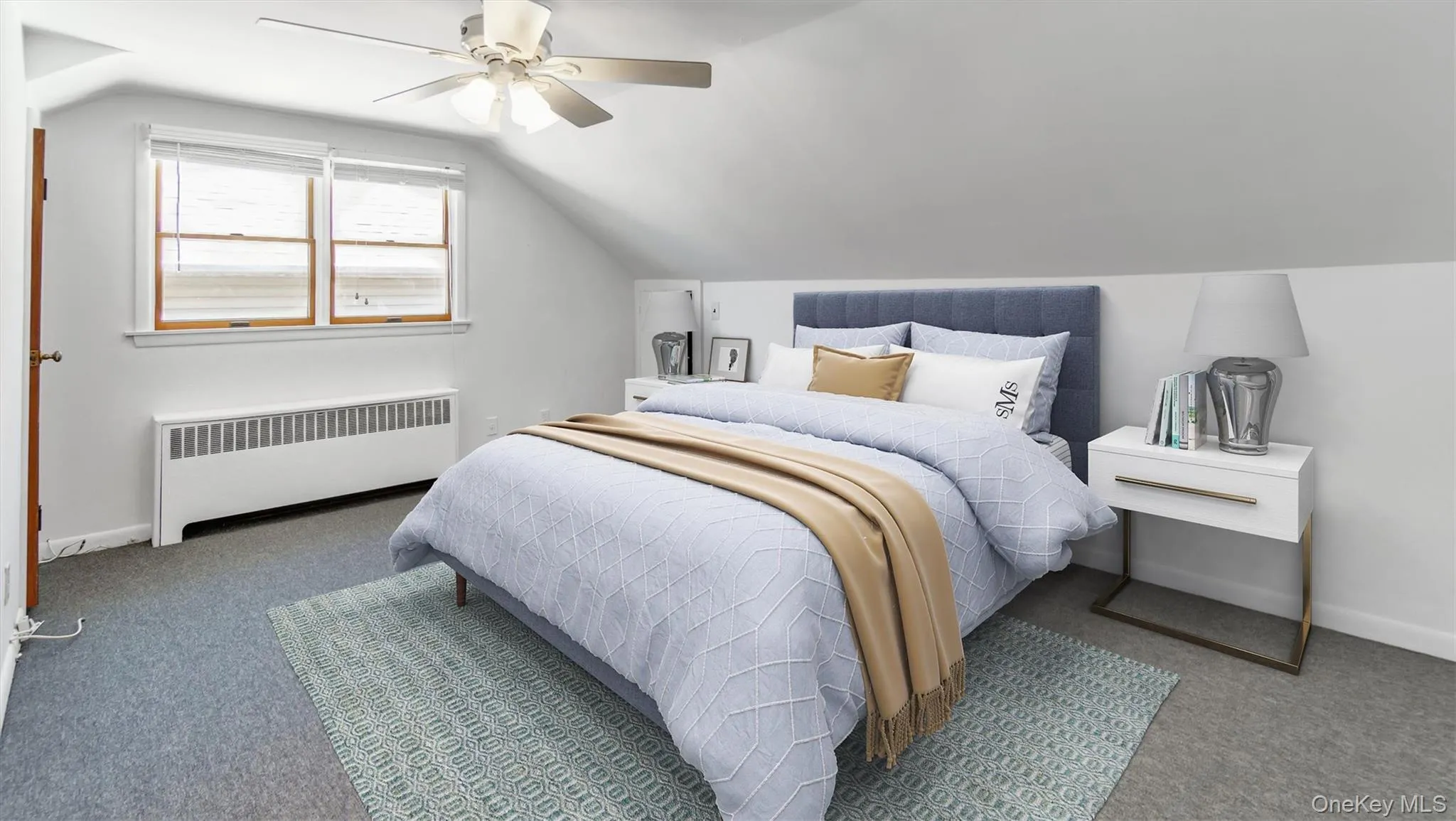 Bedroom featuring radiator heating unit, carpet, vaulted ceiling, Bedroom featuring radiator heating unit, carpet, vaulted ceiling,