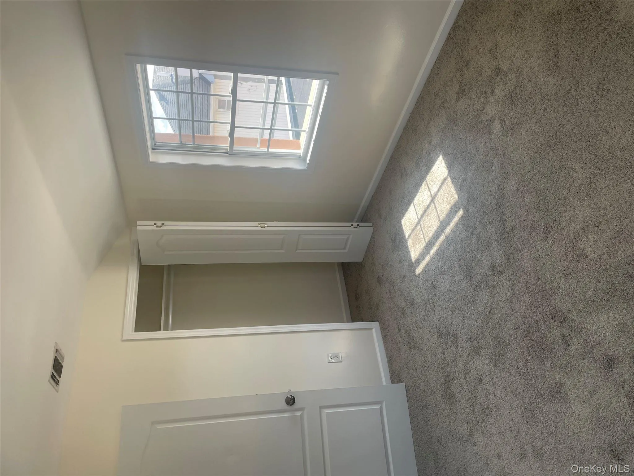 Unfurnished bedroom with carpet and a closet Unfurnished bedroom with carpet and a closet