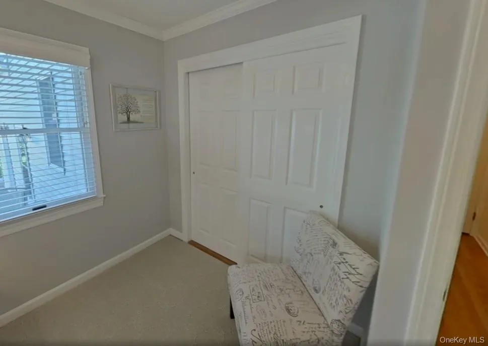 Bedroom featuring full size closet Bedroom featuring full size closet