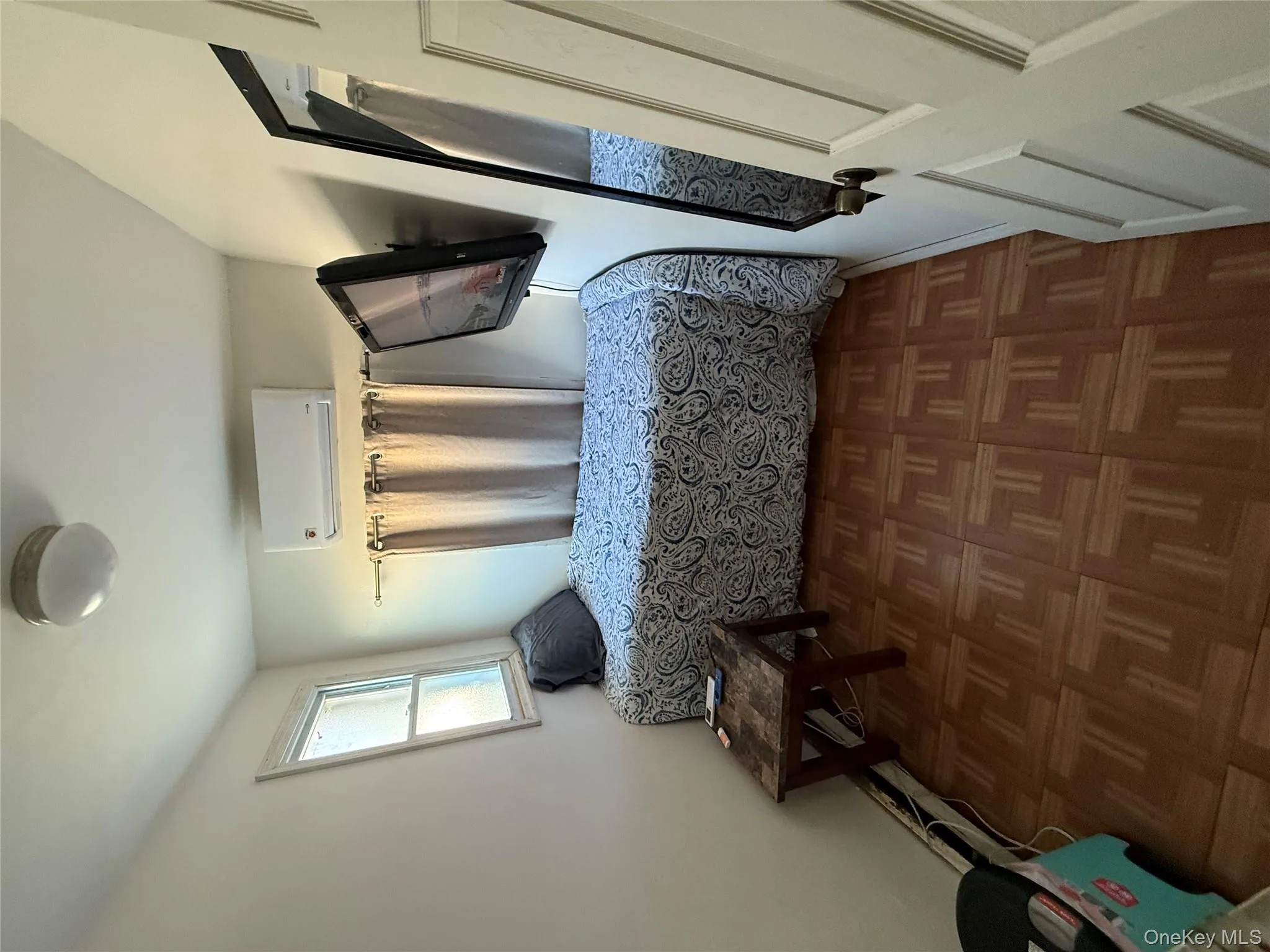 Bedroom featuring a wall mounted air conditioner Bedroom featuring a wall mounted air conditioner