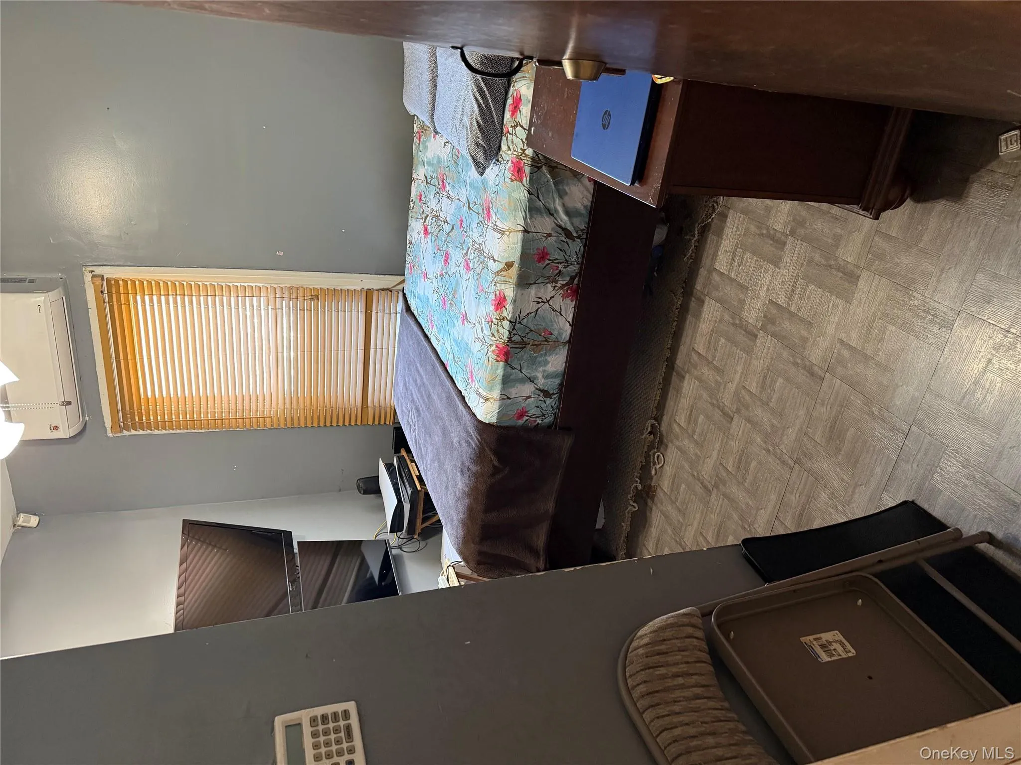 Bedroom featuring a wall unit AC Bedroom featuring a wall unit AC
