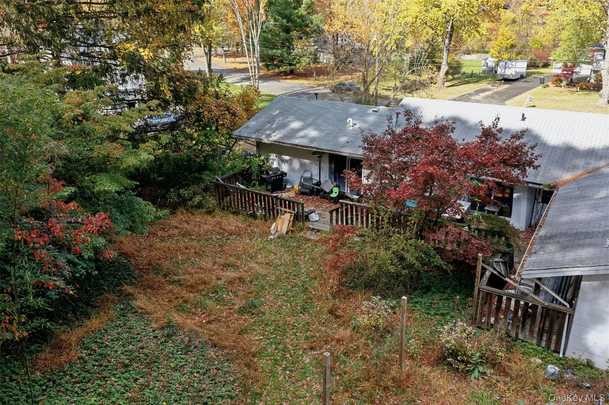 View from above of property with a tree filled landscape View from above of property with a tree filled landscape