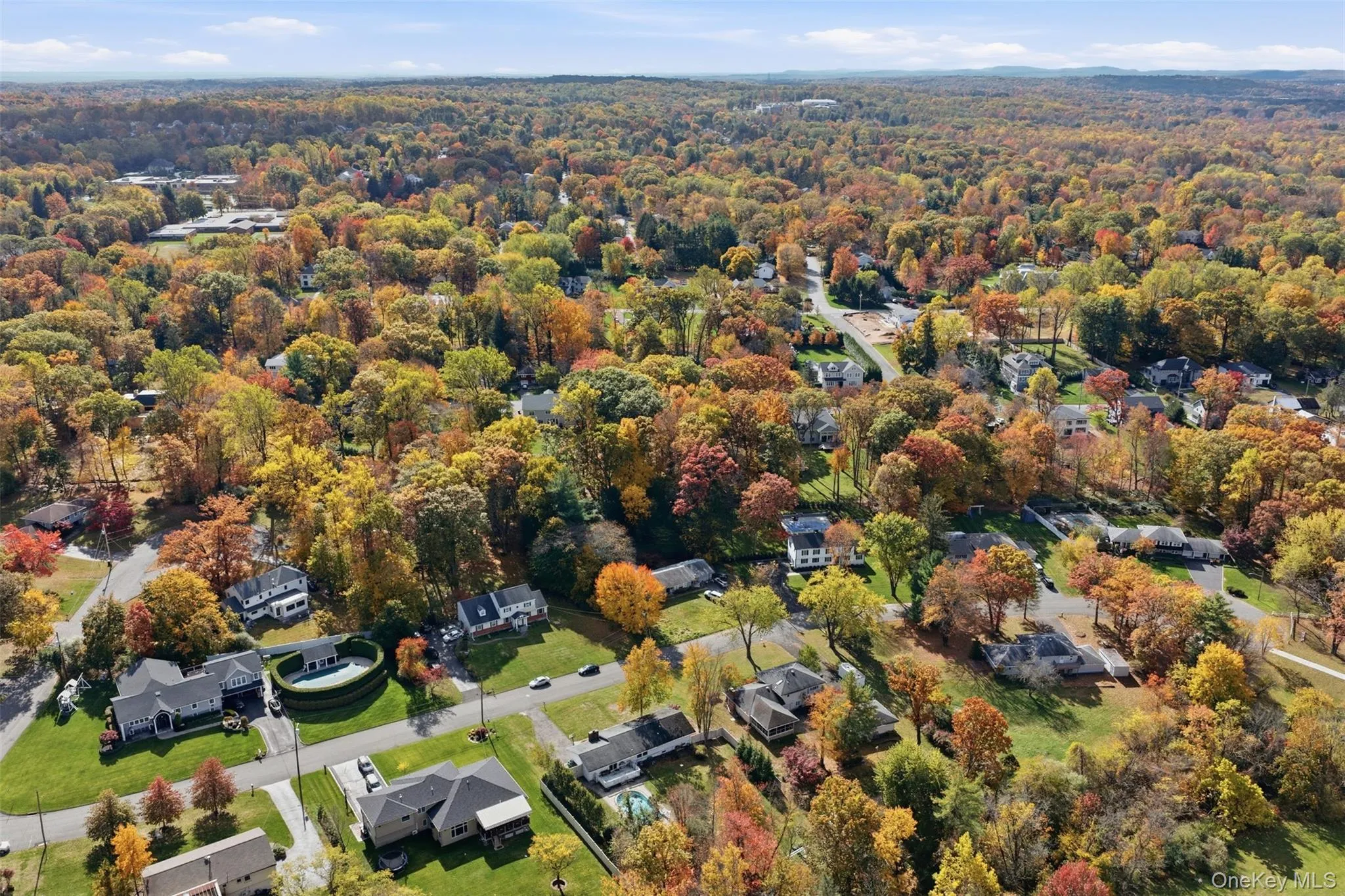 Aerial perspective of suburban area with a heavily wooded area Aerial perspective of suburban area with a heavily wooded area