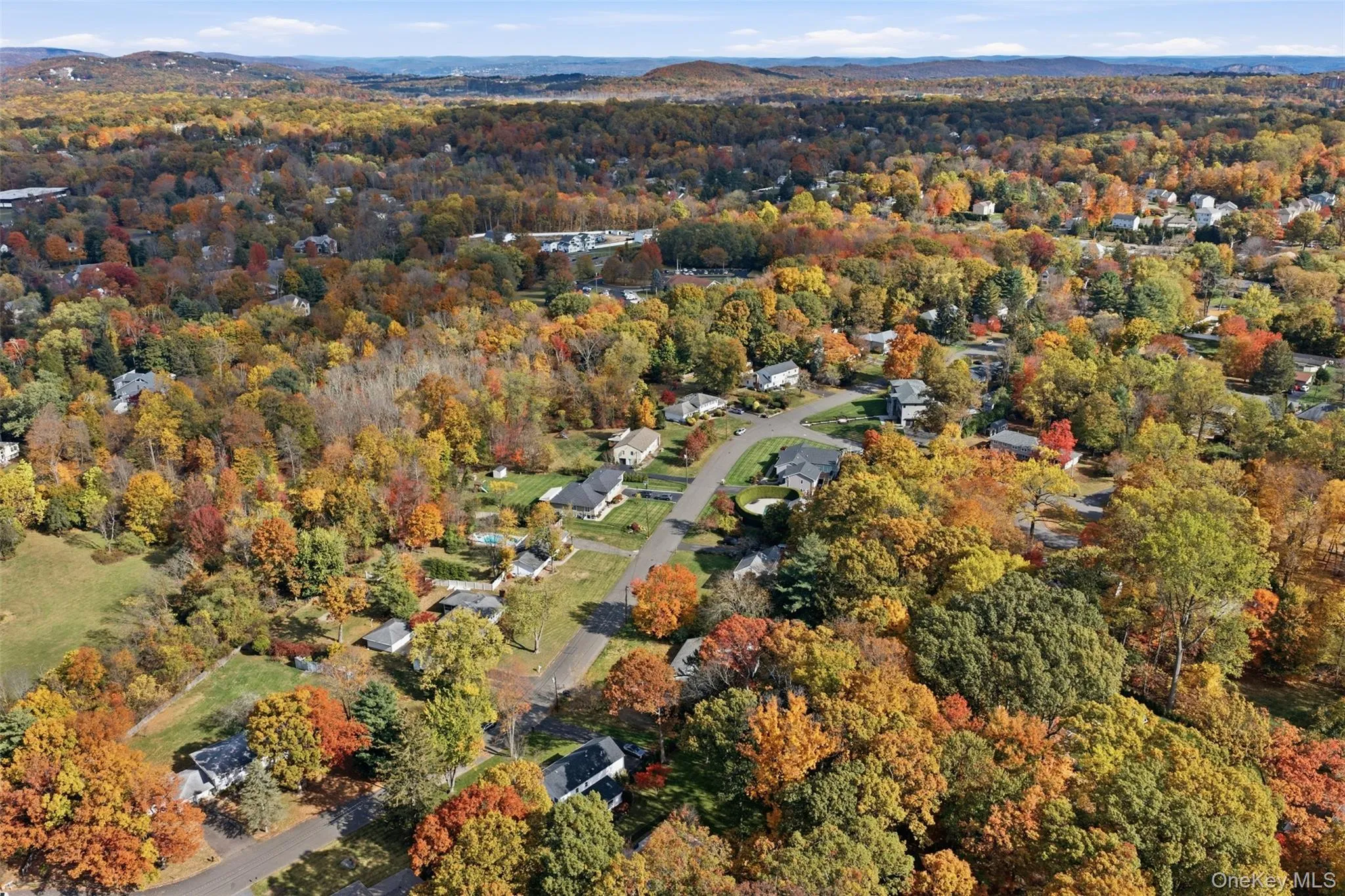 Aerial overview of property's location featuring a heavily wooded area Aerial overview of property's location featuring a heavily wooded area