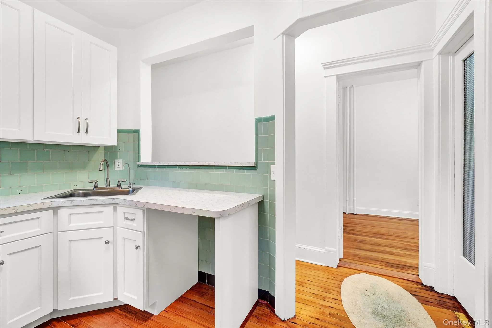 Washroom with light wood-type flooring and baseboards Washroom with light wood-type flooring and baseboards
