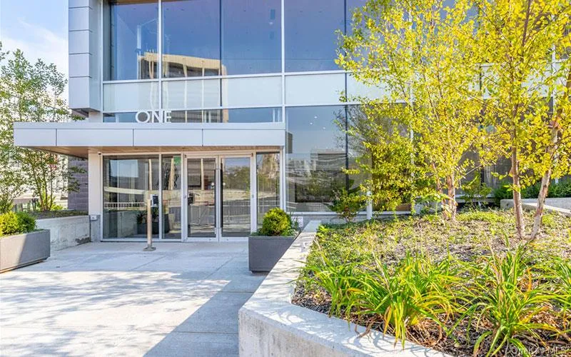 View of exterior entry featuring a sunroom View of exterior entry featuring a sunroom