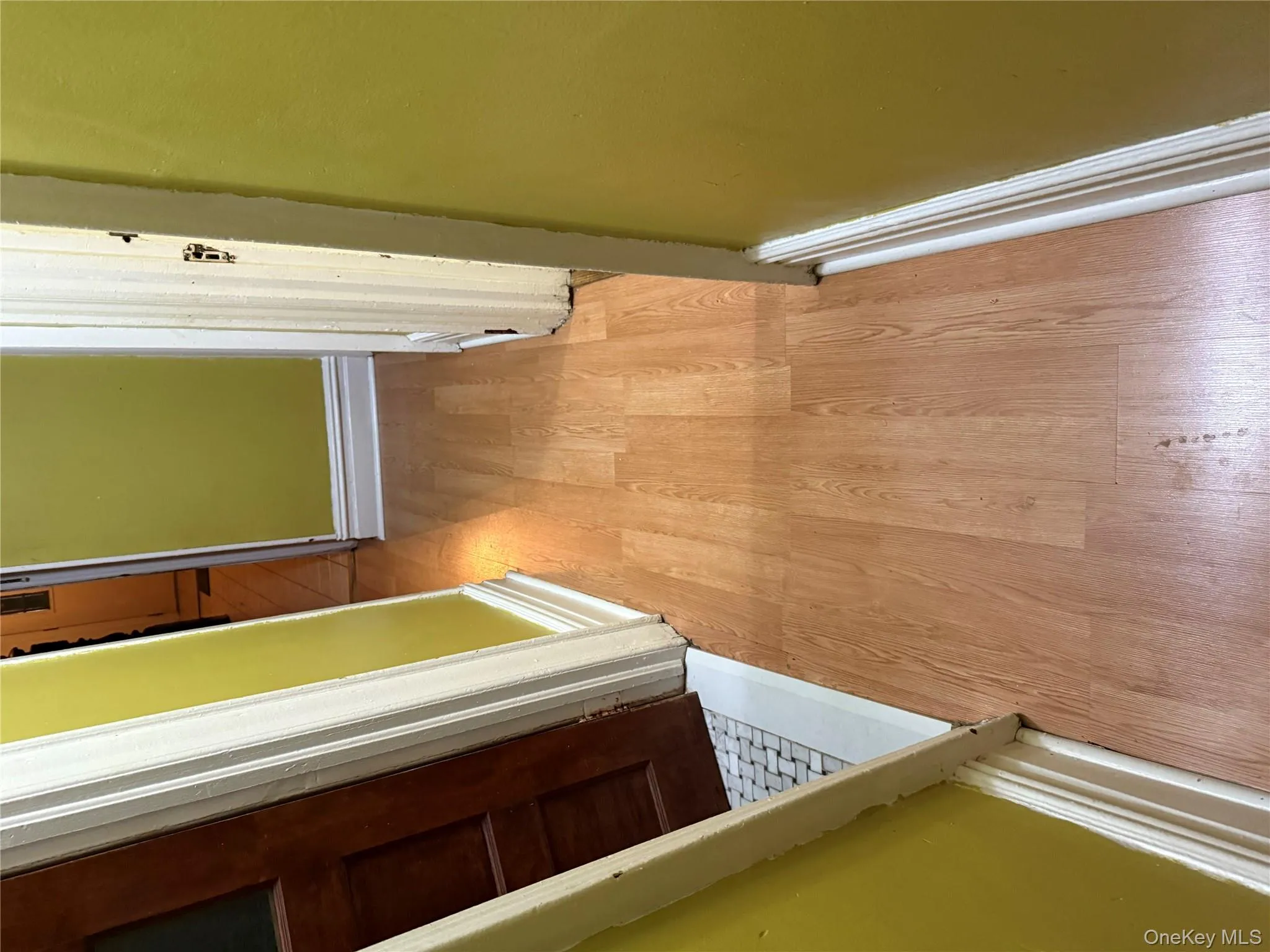 Hall featuring light wood-type flooring and baseboards Hall featuring light wood-type flooring and baseboards