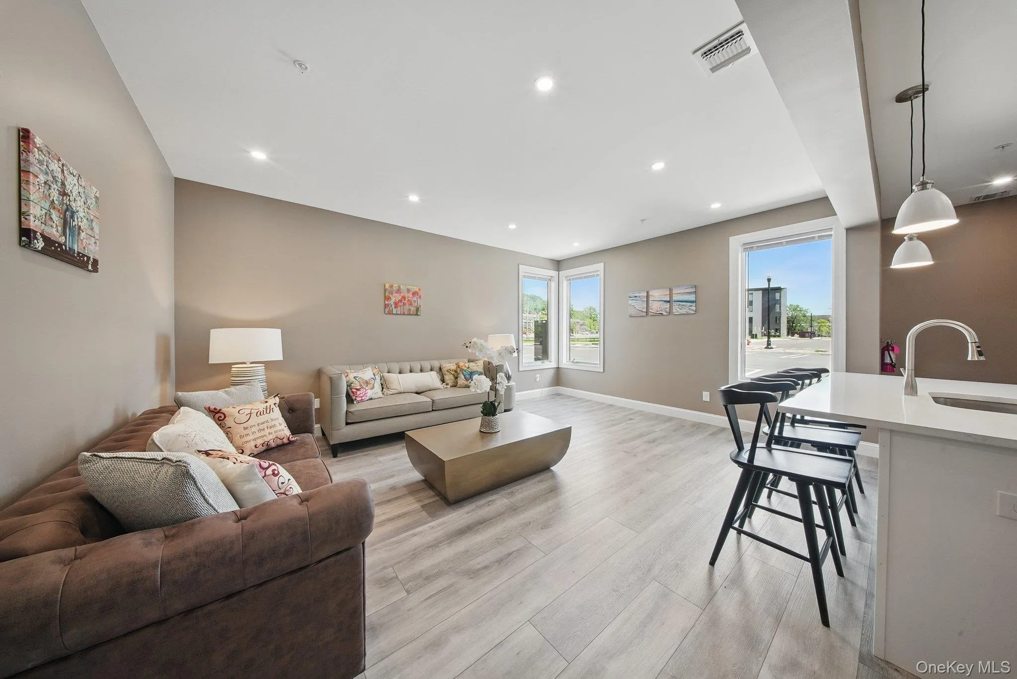 Living area featuring light wood-style floors and recessed lighting Living area featuring light wood-style floors and recessed lighting