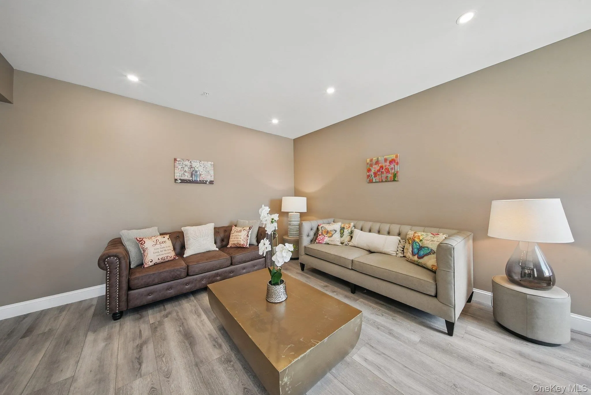 Living area with wood finished floors and recessed lighting Living area with wood finished floors and recessed lighting