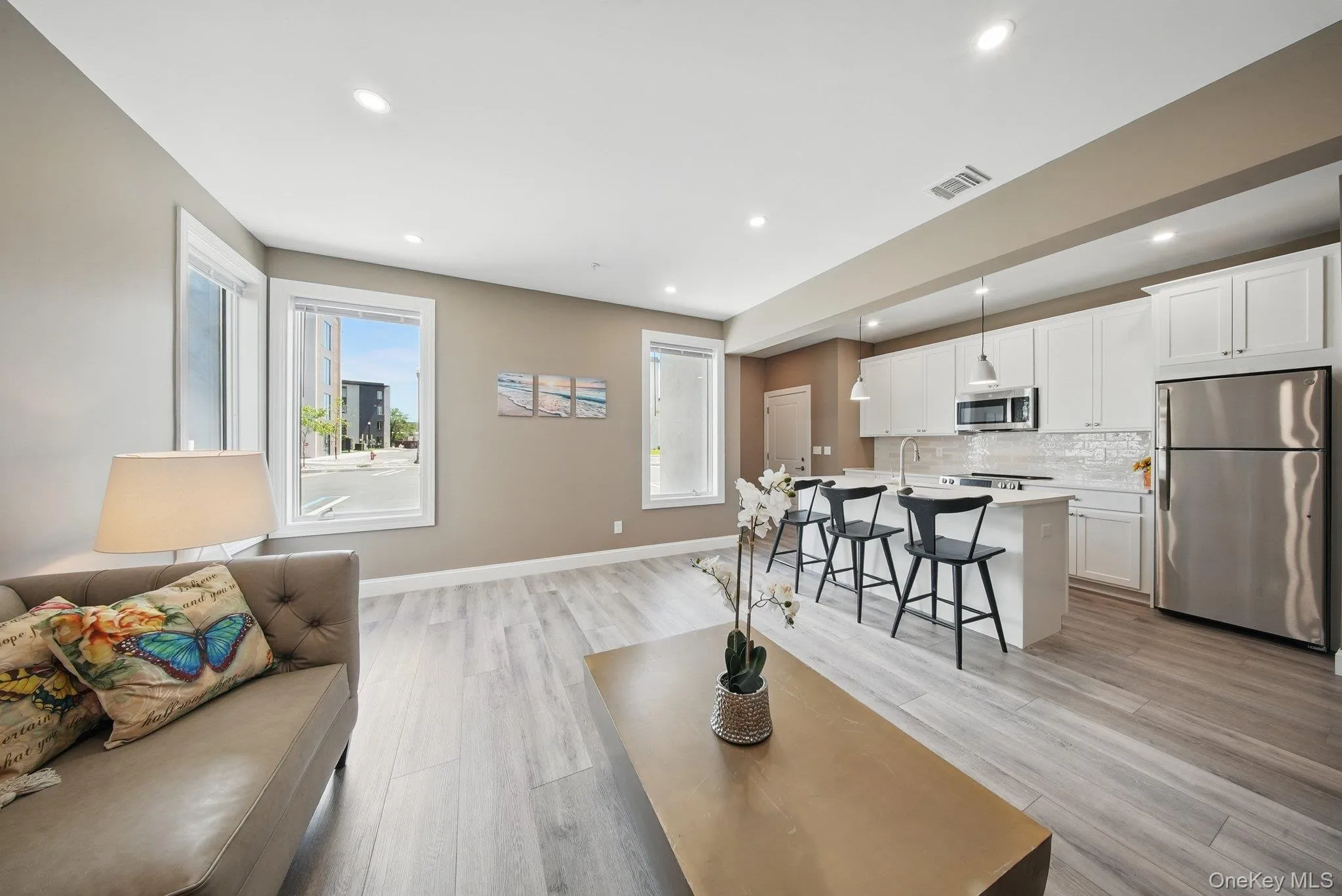 Living area featuring light wood-style floors and recessed lighting Living area featuring light wood-style floors and recessed lighting
