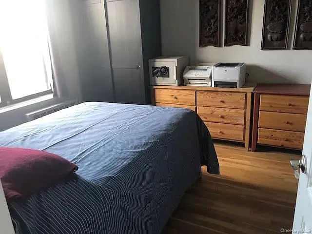 Bedroom with wood finished floors Bedroom with wood finished floors