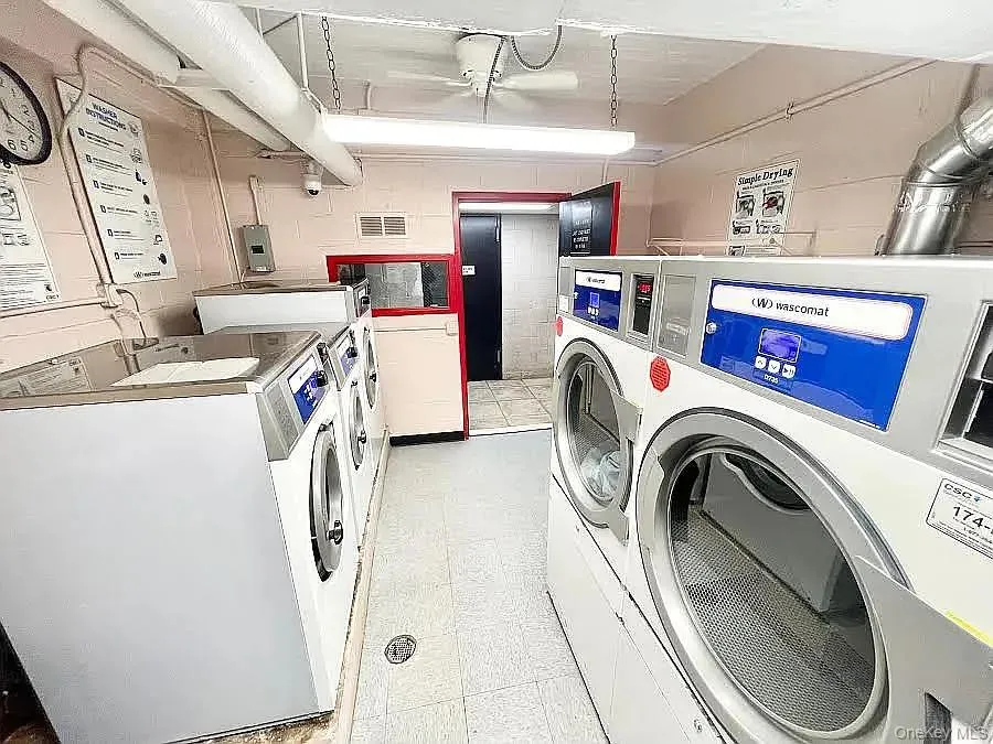 Community laundry room featuring washer and dryer Community laundry room featuring washer and dryer