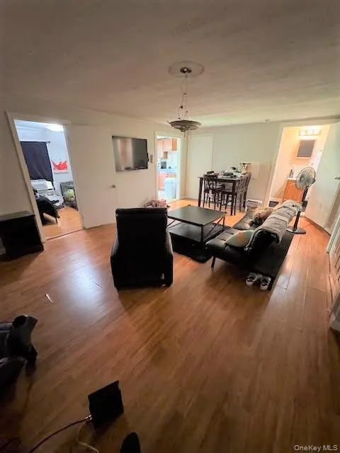 Living area with wood finished floors Living area with wood finished floors