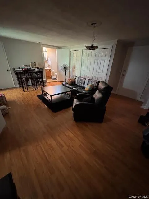 Living area with wood finished floors Living area with wood finished floors