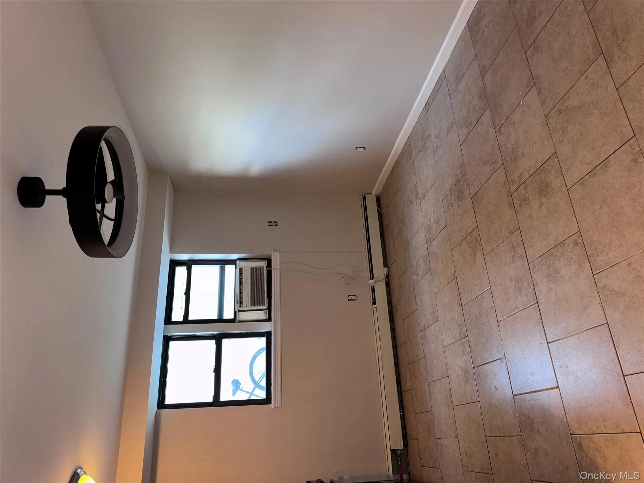 Spare room with a baseboard radiator and cooling unit Spare room with a baseboard radiator and cooling unit